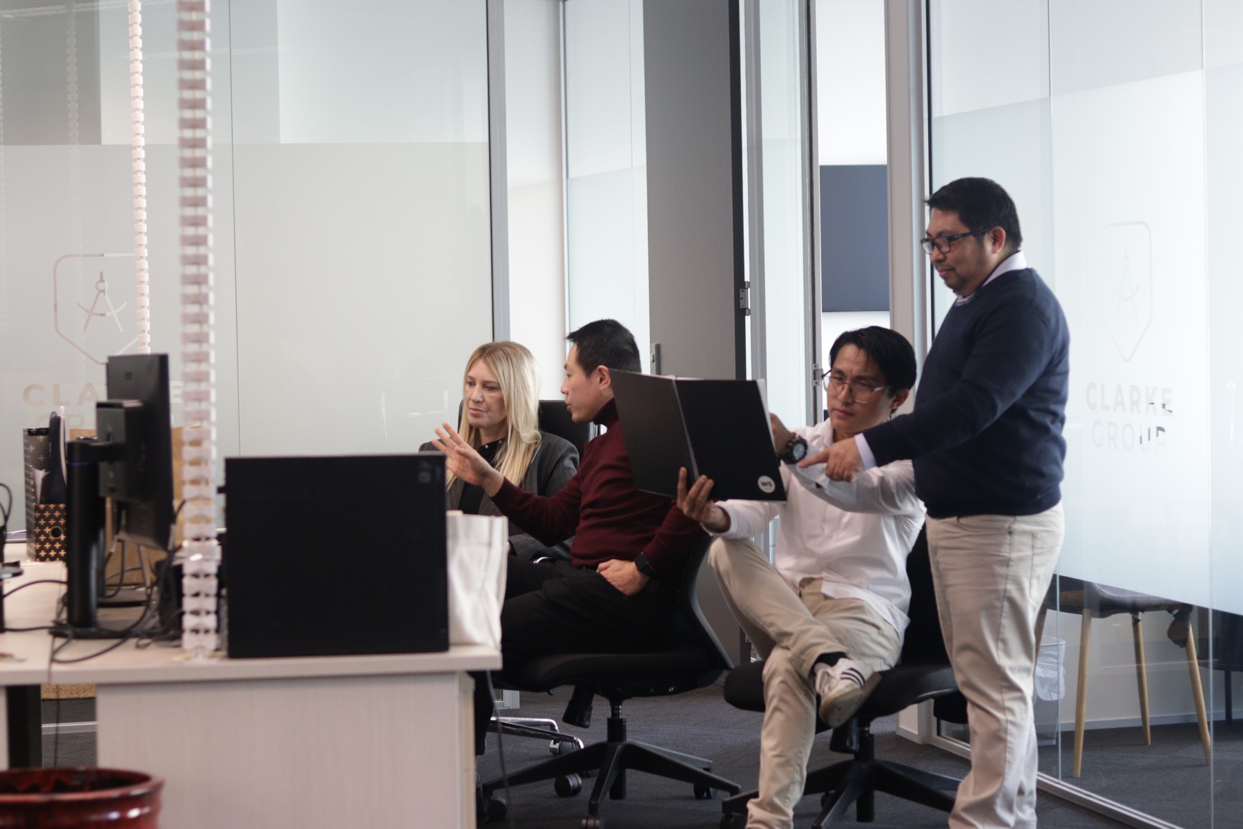 The Clarke Group team working together in their Auckland office