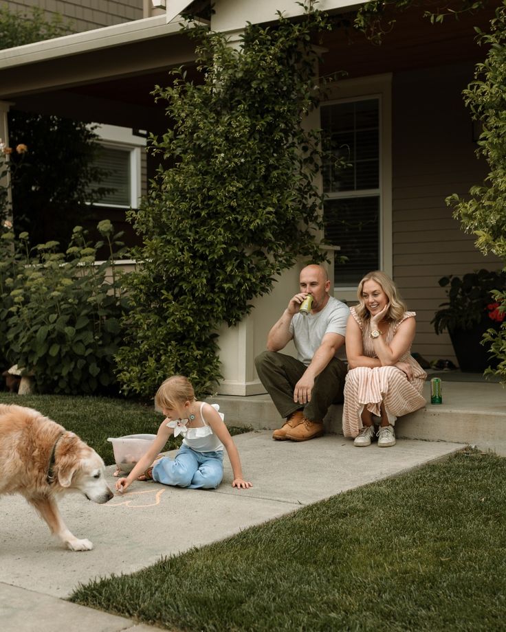 A family and their dog enjoying their garden